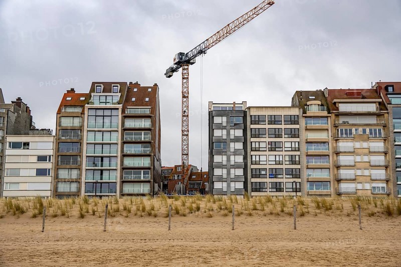 The skyline of Knokke-Heist, on the North Sea beach, dreary winter day, mostly apartment buildings with rental or condominiums, high-rise buildings on the Zeedijk-Knokke street, vacant lot, new residential building, Belgium