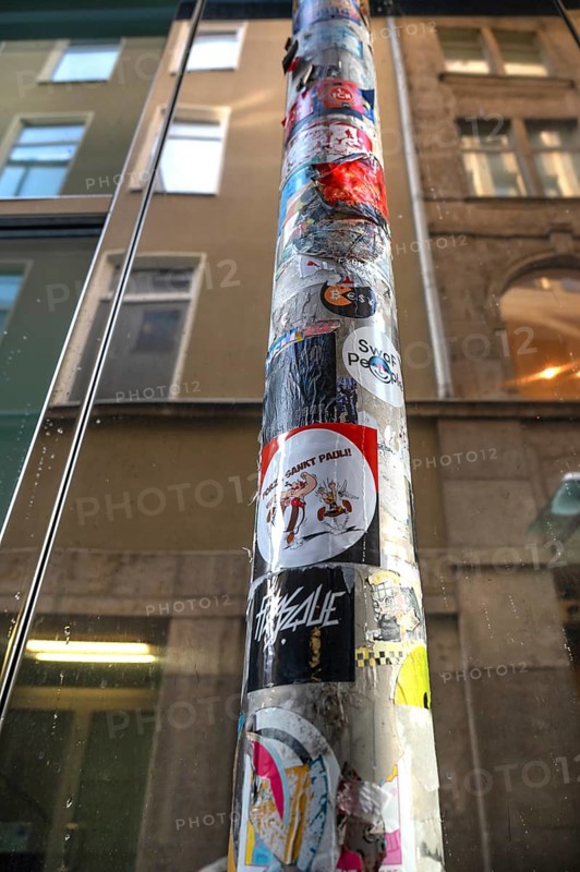 Rain pipe covered with stickers, Nuremberg, Middle Franconia, Bavaria, Germany