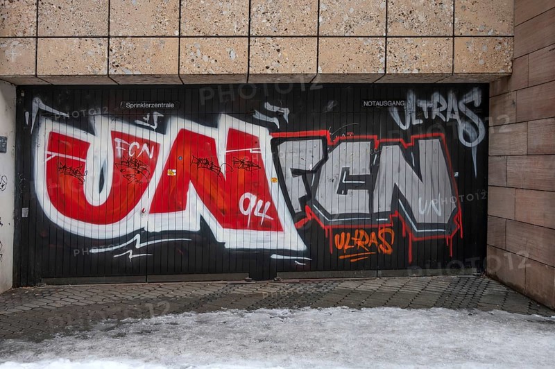 Illegal graffiti of the Nuremberger 1st FCN of the Ultras at an emergency exit, Nuremberg, Middle Franconia, Bavaria, Germany