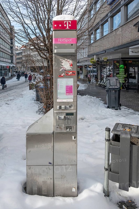 Old, broken Telekom telephone stand in the pedestrian zone, Nuremberg, Middle Franconia, Bavaria, Germany