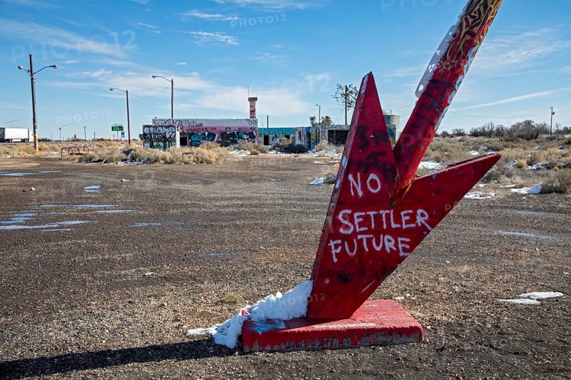 Twin Arrows, Arizona - The ruins of the Twin Arrows Trading Post, which closed in 1995. The building are now covered with graffiti, and one of the two arrows has fallen