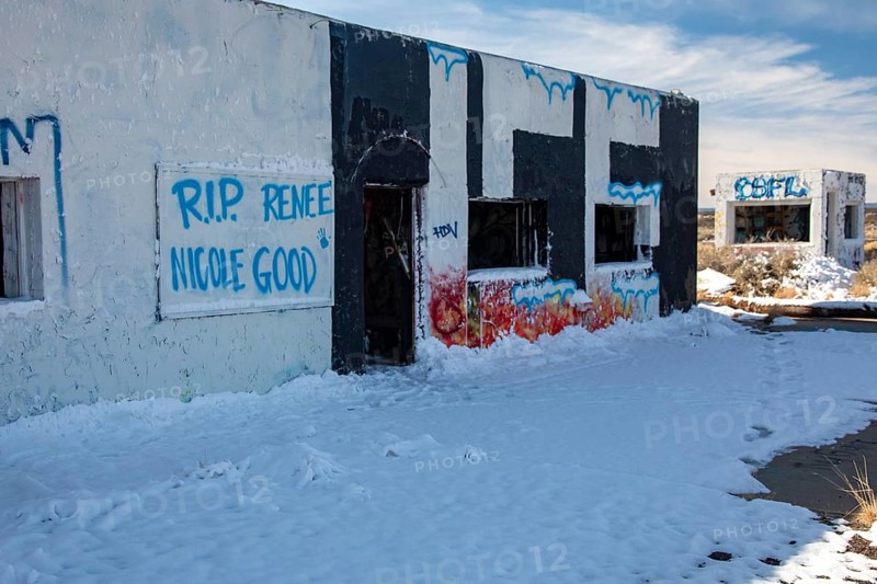 Twin Arrows, Arizona - The ruins of the Twin Arrows Trading Post, which closed in 1995. The building are now covered with graffiti, including a remembrance of Renee Good, who was killed by an ICE agent in Minneapolis in January 2026