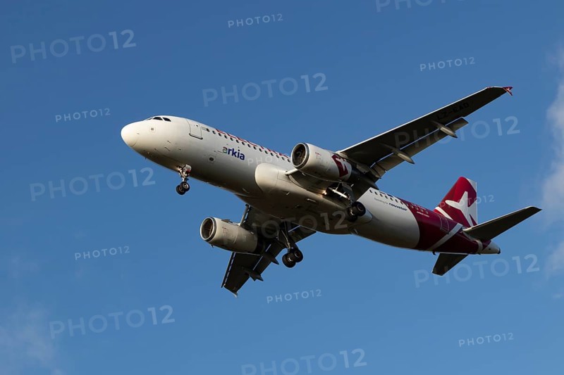 Airbus A320 commercial passenger airliner jet aircraft of Electra airlines flying on approach to land at London Stansted airport, Essex, England, United Kingdom