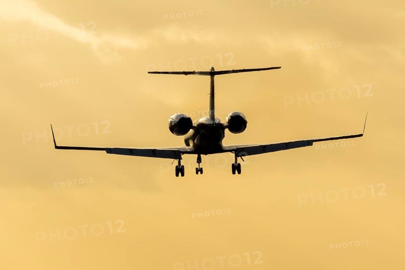Gulfstream GIV SP XA-FDM executive business jet aircraft in flight on approach to land silhouette at sunset at London Stansted airport, Essex, England, United Kingdom