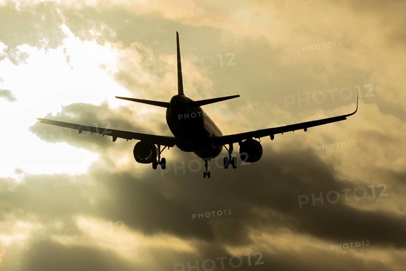 Airbus A321 commercial passenger airliner jet aircraft of Pegasus airlines flying on approach to land at sunset at London Stansted airport, Essex, England, United Kingdom