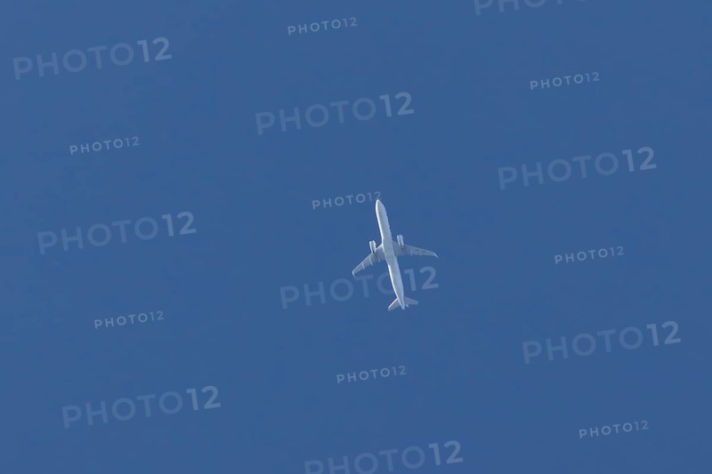Airbus A321-200 commercial passenger airliner jet aircraft of Finnair airlines flying in a blue sky, England, United Kingdom
