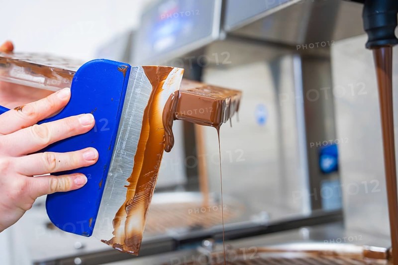 Side view of a flowing chocolate mold, vegan chocolates production, Haselstaller Hof, Gechingen, Germany