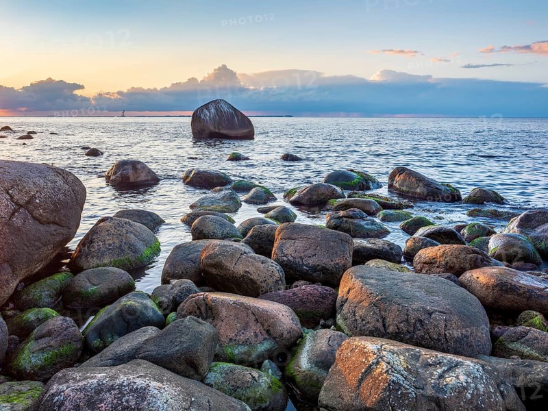 Sunset on the Baltic Sea, boulders on the shore, Schwanensteint in the back, Lohme, Jasmund National Park, Rügen Island, Mecklenburg-Western Pomerania, Germany