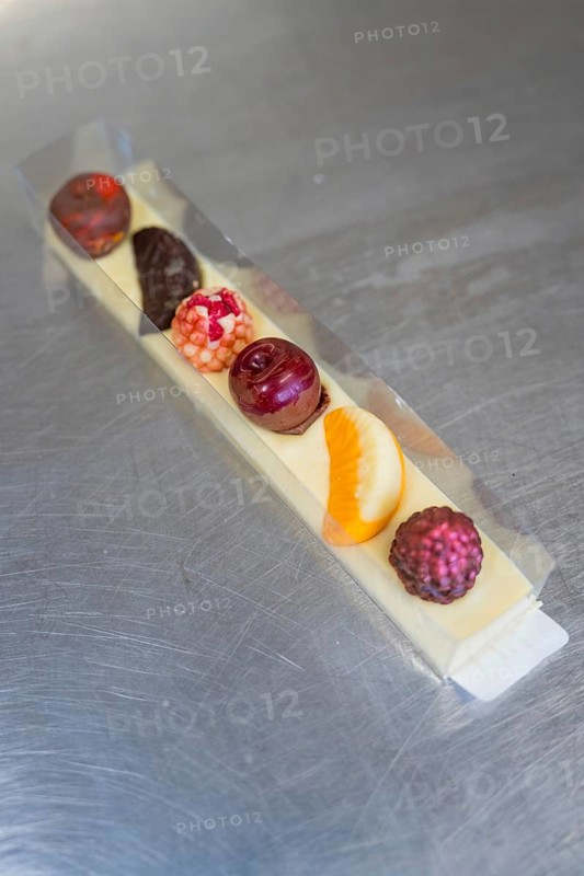 Various chocolates in a transparent gift box on a metal surface, Easter production of regional products, Haselstaller Hof, Gechingen, Calw district, Germany