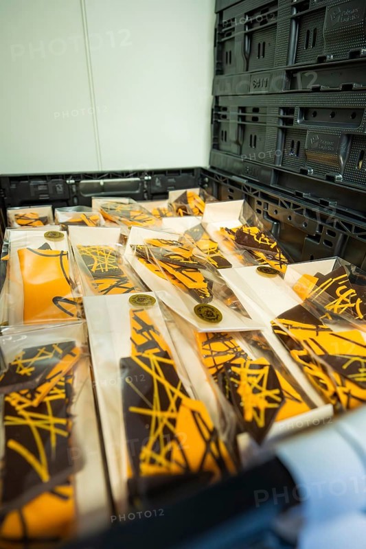 Chocolate packaging with orange-black design in a box, Easter production of regional products, Haselstaller Hof, Gechingen, Calw district, Germany