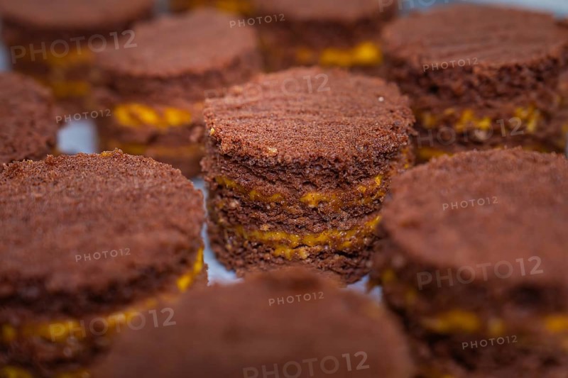 Close-up of small chocolate cakes with yellow layers, vegan cake production, Haselstaller Hof, Gechingen, Germany