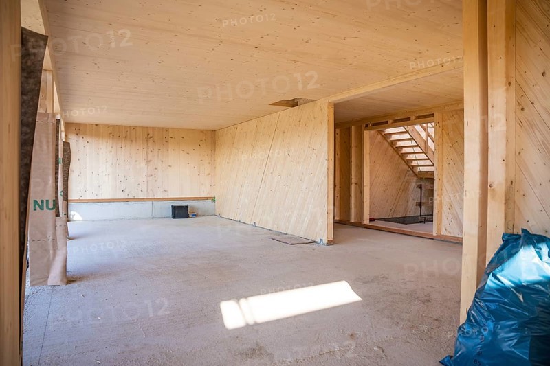 Empty interior of a timber house under construction with visible wooden walls, timber house construction, Gechingen, Germany
