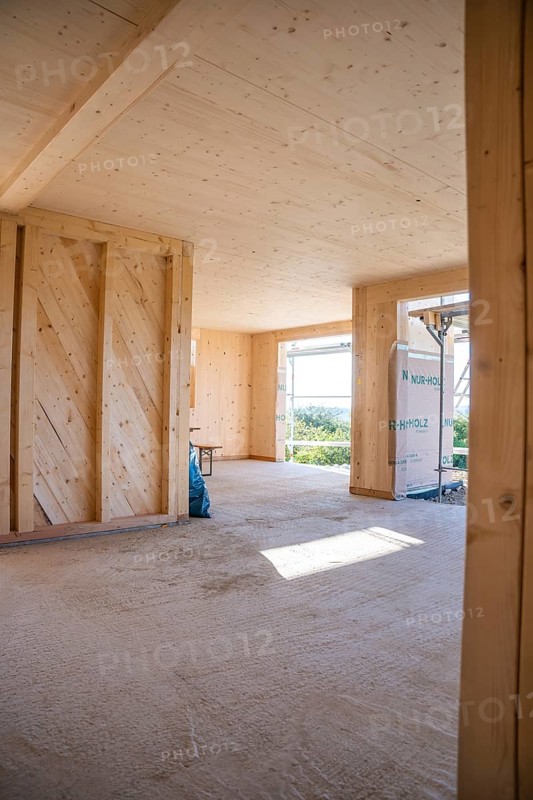 Interior view of a wooden building under construction with large amounts of light, timber house construction, Gechingen, Germany