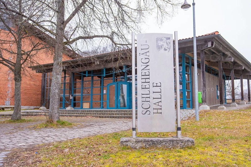 Schlehengäu Halle building with sign in front of it, surrounded by trees, winter atmosphere, Schlehengäu sports hall Gechingen, Calw district, Germany