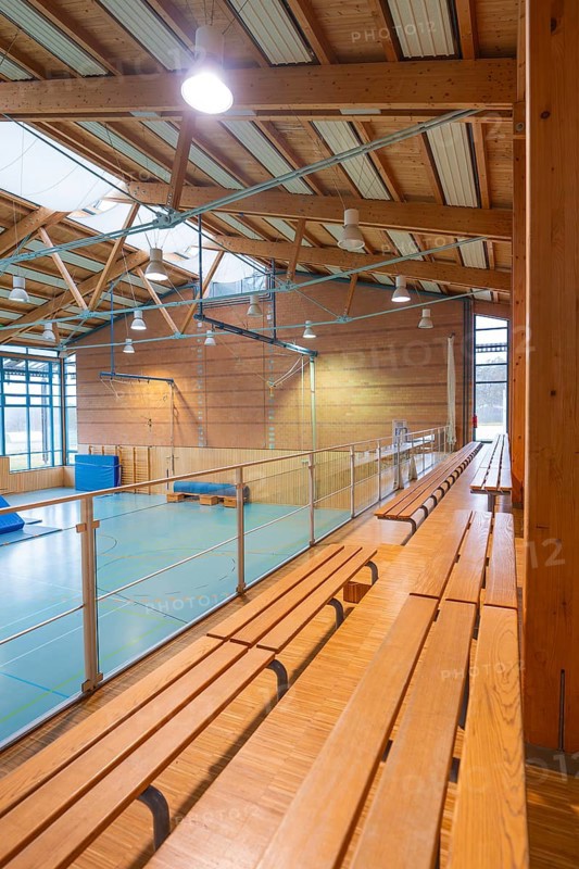 Interior of a gym with long benches and natural light, Schlehengäu Sporthalle Gechingen, Calw district, Germany