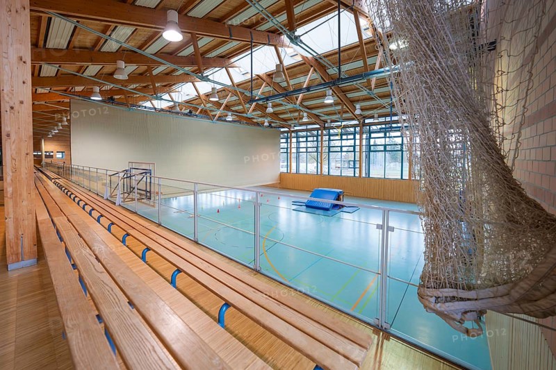 View over the stand of a sports hall with wooden structure and playing field, Schlehengäu Sporthalle Gechingen, Calw district, Germany