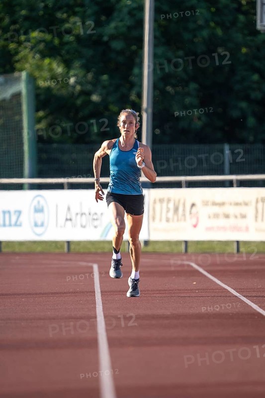 Woman running fast on a track during training, middle distance runner Katharina Jaiser, Gechingen, Germany