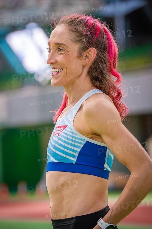 Smiling sportswoman with pink hair in stadium, looks fit and friendly, middle distance runner Katharina Jaiser, Gechingen, Germany