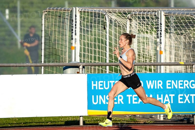 Woman running fast and dynamically on a sports track, middle distance runner Katharina Jaiser, Gechingen, Germany