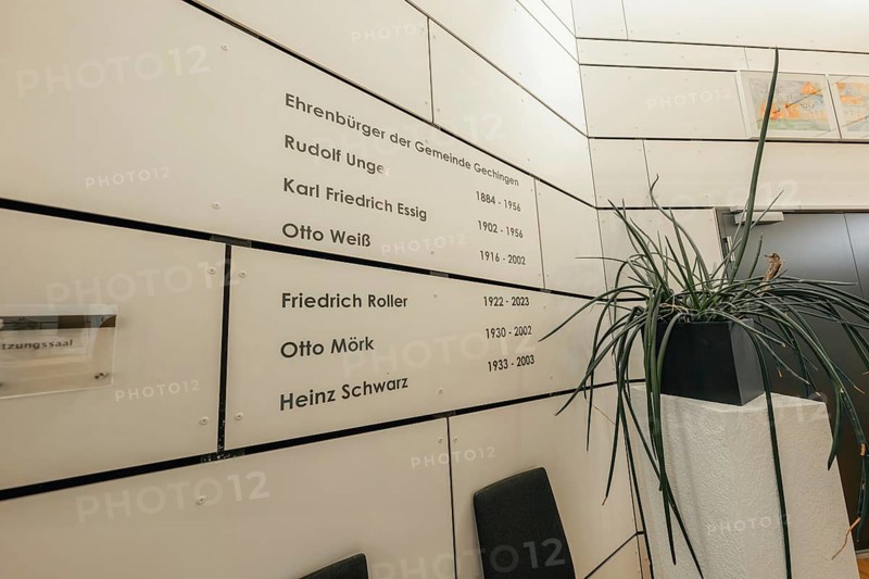 Wall with honorary citizenship, simply designed, surrounded by plants, Gechingen Town Hall, Calw district, Germany