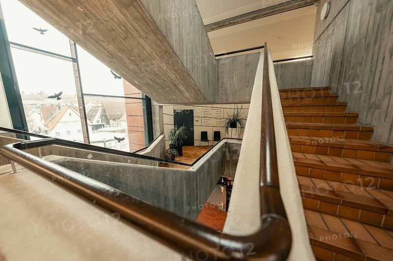 Modern staircase with concrete walls and windows, open architecture with city view, Gechingen Town Hall, Calw district, Germany