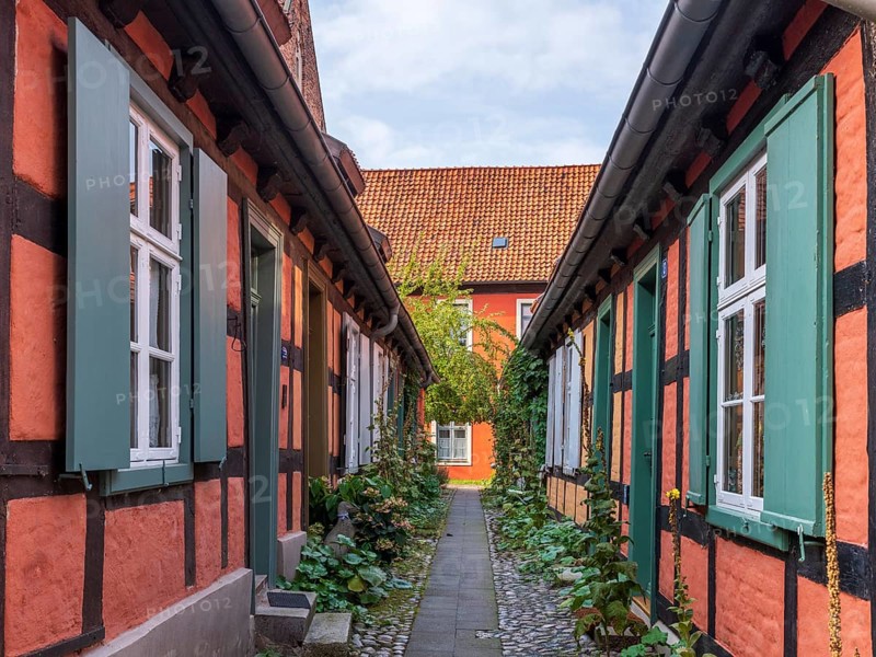 Narrow alley with half-timbered houses in the Heilgeisthospital, also Heilgeistkloster or Kloster zum Heilige Geist, Hanseatic City of Stralsund, Mecklenburg-Western Pomerania, Germany