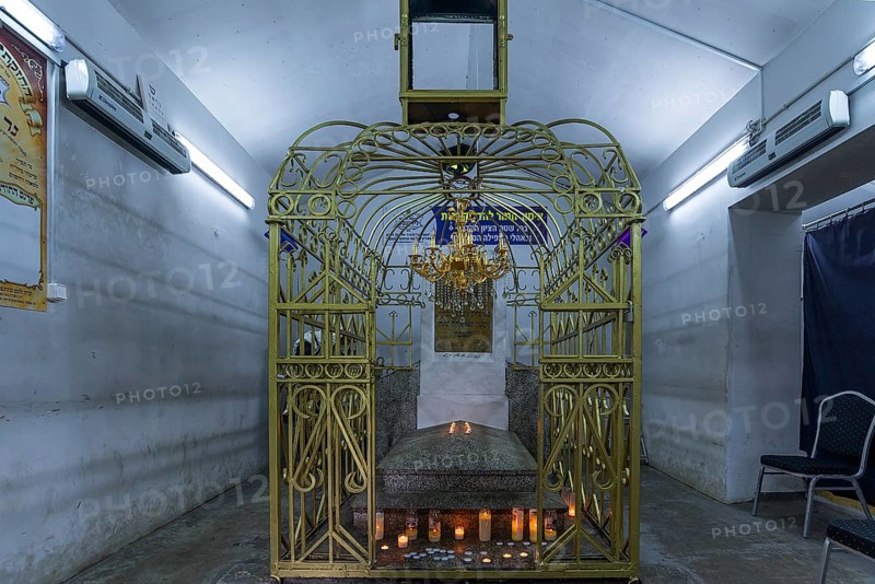 Tomb of Hasidic Rabbi Elimelech in a gilded grid at the Lezajsk Jewish Cemetery, Poland