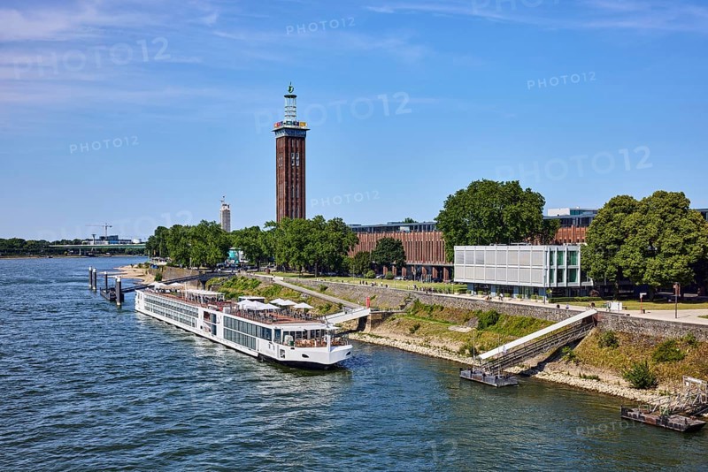 Rhine river, Rheinhallen exhibition halls, brick architecture, exhibition tower, general architecture, bridge, waterfront, river cruise ship Viking Einar, Viking Cruises, pier, Duckdalben, gangway, wharf, wharf, trees, bird's-eye view, blue sky, cirrus clouds, Kennedy shore, Cologne, district-free city, North Rhine-Westphalia, Germany