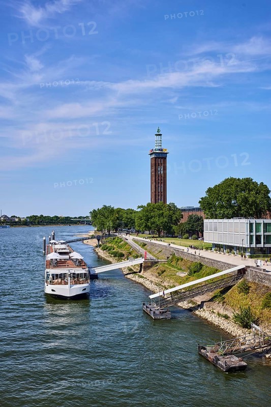Rhine river, Rheinhallen exhibition halls, brick architecture, exhibition tower, general architecture, high-rise buildings, waterfront, river cruise ship Viking Einar, Viking Cruises, pier, Duckdalben, gangway, wharf, wharf, trees, bird's-eye view, blue sky, cirrus clouds, Kennedy shore, Cologne, district-free city, North Rhine-Westphalia, Germany