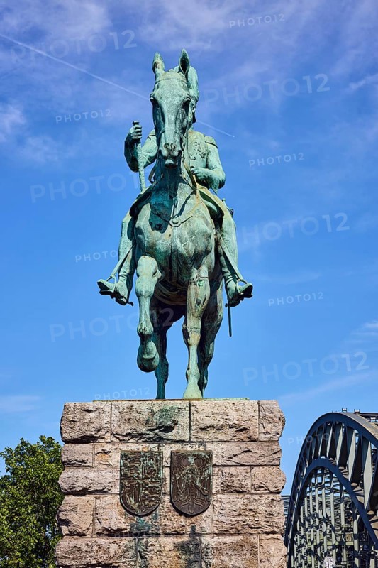 Equestrian statue of Emperor Frederick III, bridge, arched steel arches, sandstone pedestal, tree, blue sky, cirrus clouds, Hohenzollern bridge, Cologne, district-free city, North Rhine-Westphalia, Germany