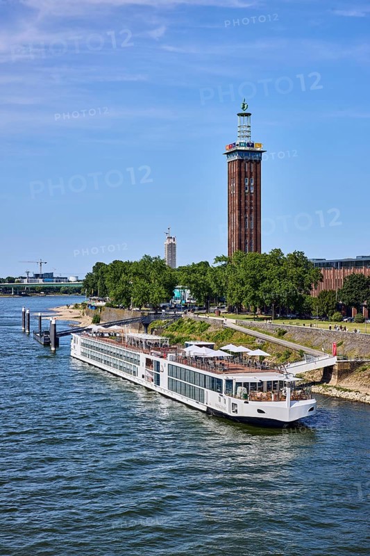 Rhine river, Rheinhallen exhibition halls, brick architecture, exhibition tower, general architecture, bridge, waterfront, river cruise ship Viking Einar, Viking Cruises, pier, Duckdalben, gangway, wharf, wharf, trees, bird's-eye view, blue sky, cirrus clouds, Kennedy shore, Cologne, district-free city, North Rhine-Westphalia, Germany