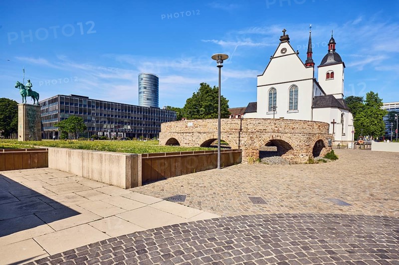 Historic railway hub, Alt St. Heribert church, general architecture, commercial building, high-rise building, equestrian statue, lantern, cobblestone sidewalk and natural stone slabs, lawn, blue sky, cirrus clouds, Urbanstraße, Kennedy-Ufer, Cologne, district-free city, North Rhine-Westphalia, Germany