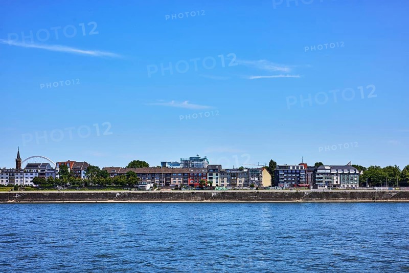 Rhine river, total view, shore, quay wall, general architecture, houses, trees, blue sky, cirrus clouds, Deutz shipyard, Cologne, district-free city, North Rhine-Westphalia, Germany