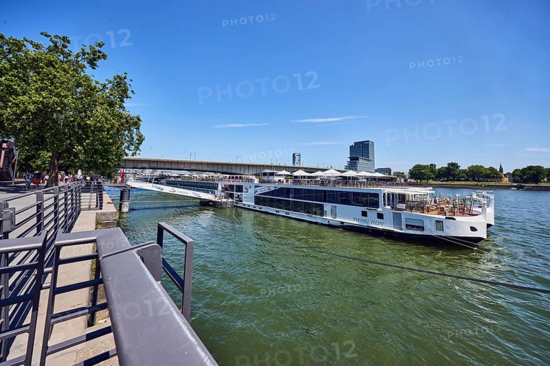 Rhine river, Viking Hlin river cruise ship, Viking Cruises, waterfront, metal railings, high-rise buildings, trees, blue sky, cirrus clouds, Leystapelwerft, Cologne, district-free city, North Rhine-Westphalia, Germany