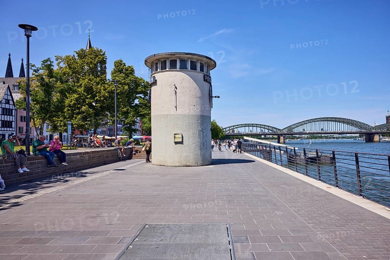 Level, river Rhine, waterfront, metal railing, lantern, sandstone wall, general architecture, boat launch, gangway, pedestrians and seated people as side motifs, trees, blue sky, cloudless, Leystapelwerft, Cologne, district-free city, North Rhine-Westphalia, Germany