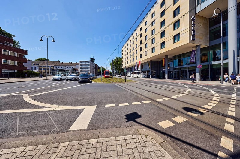 Dorint hotels, general development, commercial buildings, modern architecture, overhead lines, tram tracks, road, cycle path, turning facility, car, pickup truck, coach, lantern, road markings lanes, blue sky, cloudless, intersection Kleine Sandkaul, Augustinerstraße and Pipinstraße, Cologne, district-free city, North Rhine-Westphalia, Germany