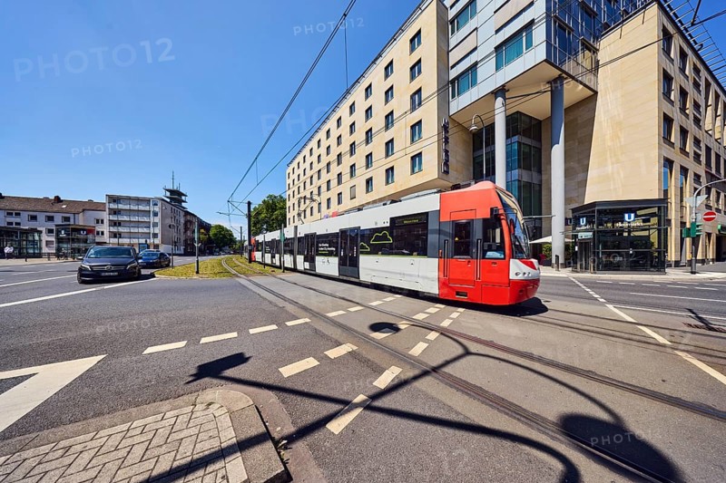 Dorint hotels, general development, commercial buildings, modern architecture, tram, overhead lines, tram tracks, car, road, cycle path, road markings lanes, blue sky, cloudless, intersection Kleine Sandkaul, Augustinerstraße and Pipinstraße, Cologne, district-free city, North Rhine-Westphalia, Germany
