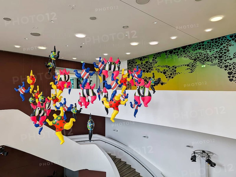 Colorful sculptures, Nanas, artist Niki de Saint Phalle, colorful figures, woman hanging in the stairwell, feminist art, Love you for Infinity exhibition at the Sprengel Museum, Hanover, Germany