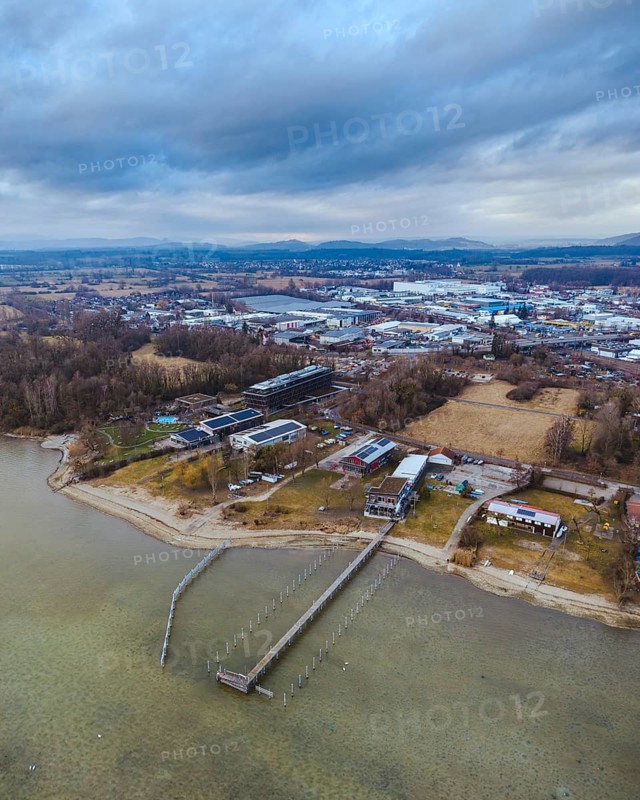 Aerial view of the town of Radolfzell on Lake Constance with the riverbanks and filming location of the television series WaPo Lake Constance, on the horizon the Hegauberge, district of Constance, Baden-Württemberg, Germany
