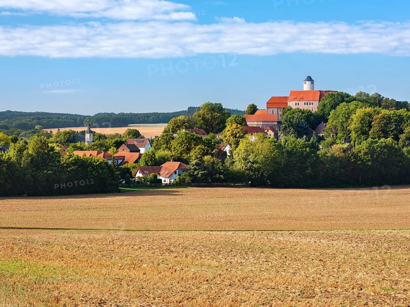 View of ploughed field at Schönfels Castle and Village in Lichtentanne, Saxony, Germany