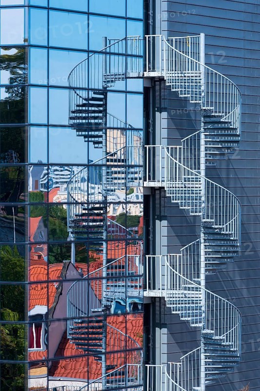 Modern glass façade with spiral staircase, fire escape, Erfurt, Thuringia, Germany