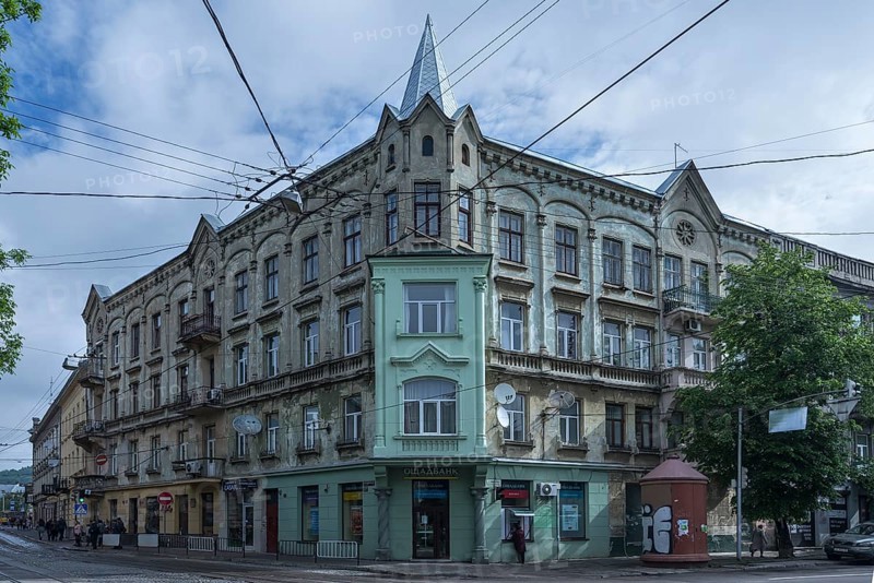 19th century dilapidated tenement house, restored bay window, Lemberg, Ukraine