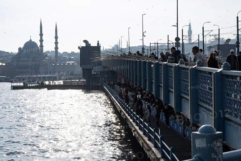 Istanbul, Turkey. December 2nd 2025. The Galata Bridge crossing the entrance to the Golden Horn and the Bosphorus Straight with the minarets of Yeni Cami n the background