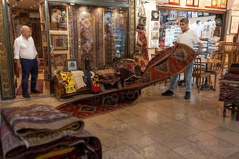 Istanbul, Turkey. June 23rd 2025. Antique carpet and rug traders doing business in the Grand Bazaar, Istanbul, one of the largest and oldest covered markets in the world, Turkey
