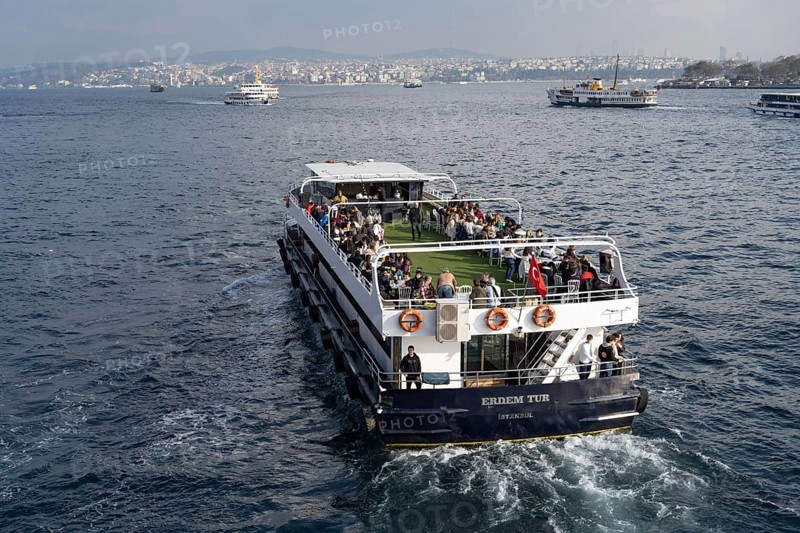 Istanbul, Turkey. December 2nd 2025. A Turkish tour boat with tourists leaves the Golden Horn and Galata Bridge and heads towards the Bosphorus Straight and the Black Sea
