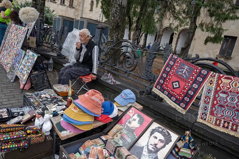 Gori, Georgia. September 9th 2025. A man selling Stalin souvenirs and memorabilia outside the Stalin Museum in Gori, birthplace of the former Soviet leader in Georgia