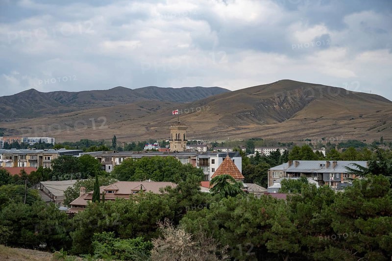 Gori, Georgia. September 9th 2025. Panoramic landscape view with the Georgian flag flying from the Stalin Museum building, Gori, Georgia