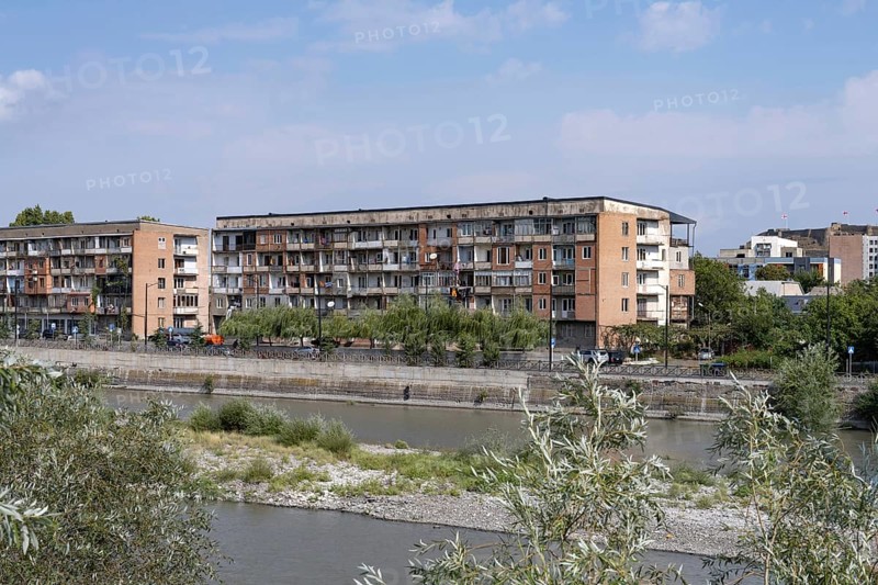 Gori, Georgia. September 9th 2025. Soviet style housing buildings beside the Kura Rive in Gori, a Georgian city famous for being the birth place of Joseph Stalin former Soviet leader. Georgia