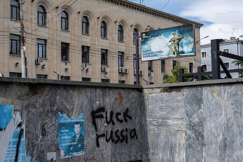 Gori, Georgia. September 10th 2025. Anti-Russia graffiti sprayed on a subway wall with a billboard requiting for the Georgian military in the center of Gori, birthplace of Joseph Stalin, Georgia