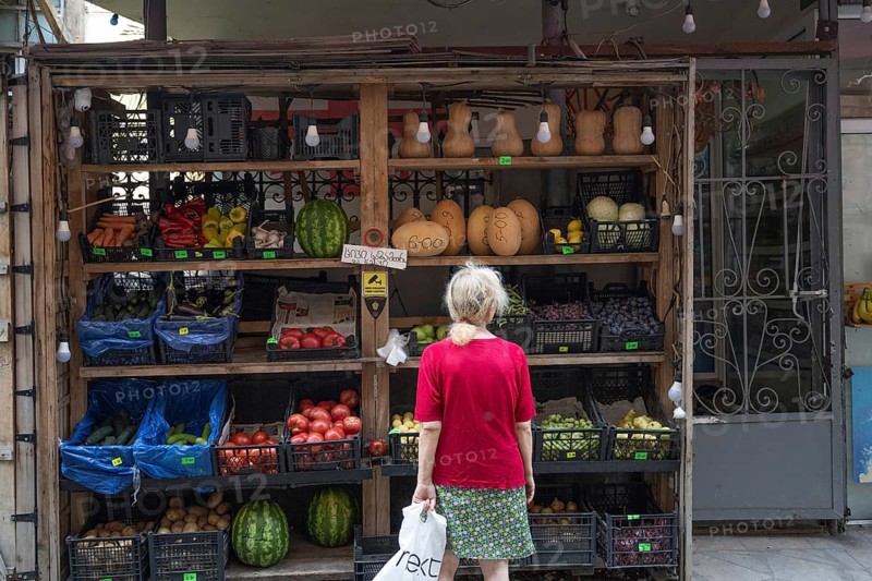 Tbilisi, Georgia. July 29th 2025. A woman shopping at a local grocery shop selling fruit and vegetables in the Old Town of Tbilisi, Georgia